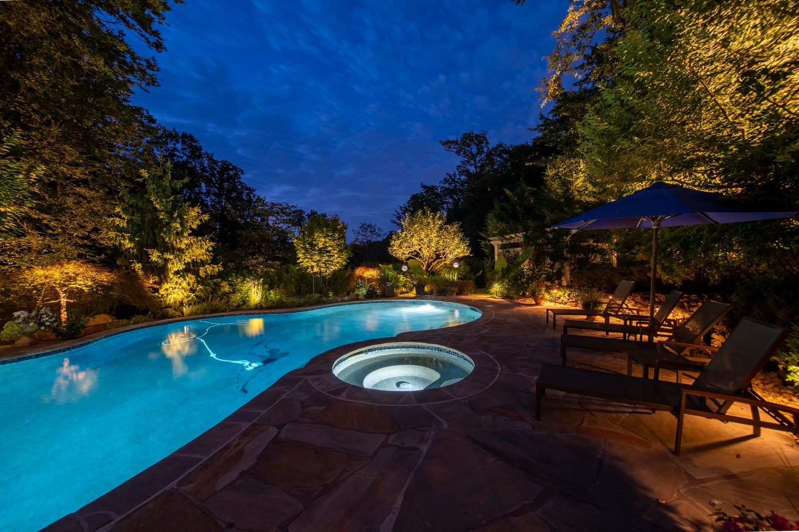 A New Jersey property lit at night by Unique Outdoor Lighting