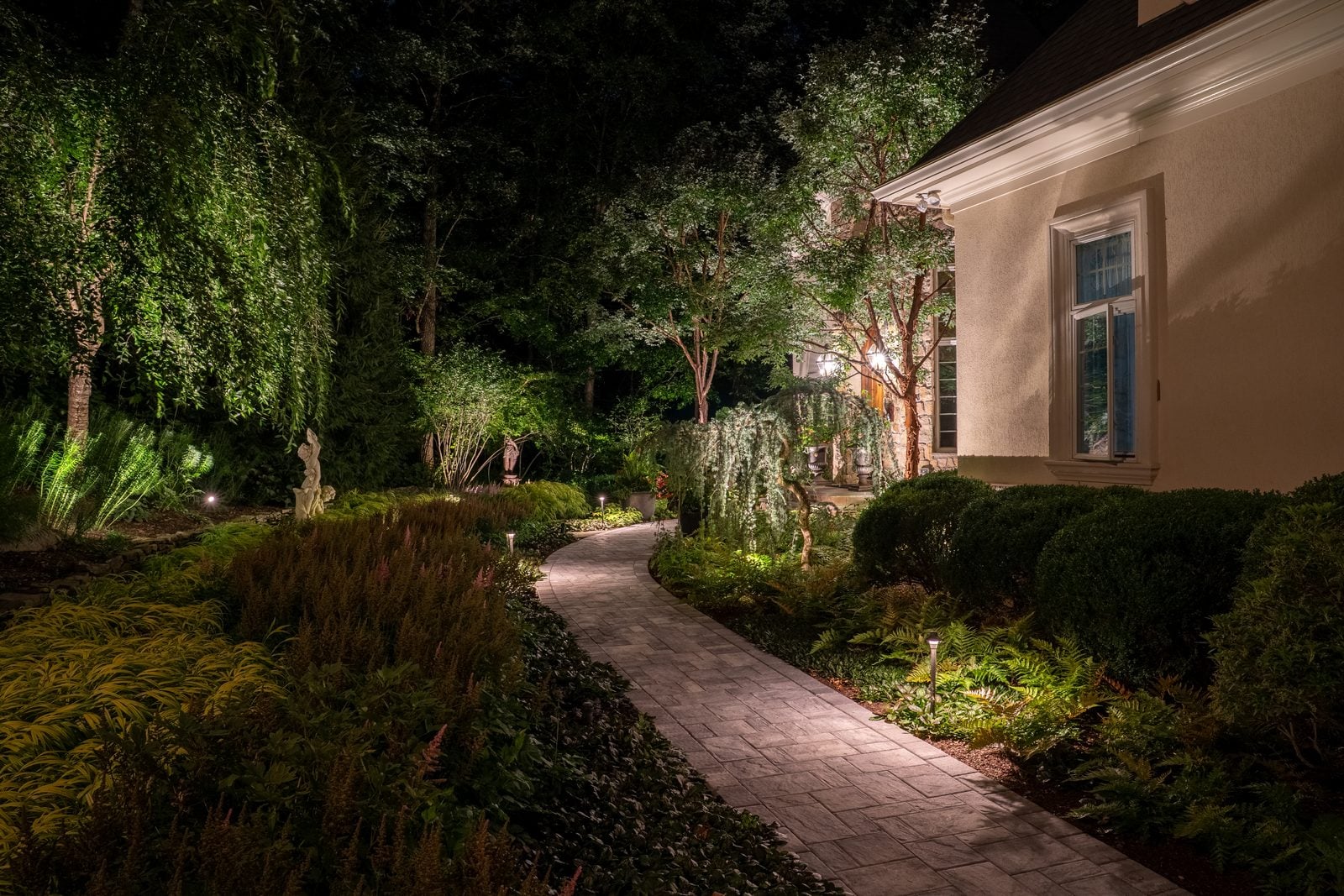 A New Jersey property lit at night by Unique Outdoor Lighting