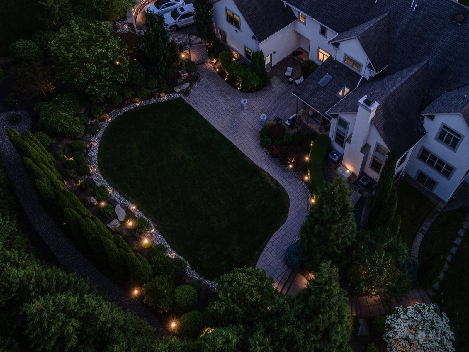 A New Jersey property lit at night by Unique Outdoor Lighting