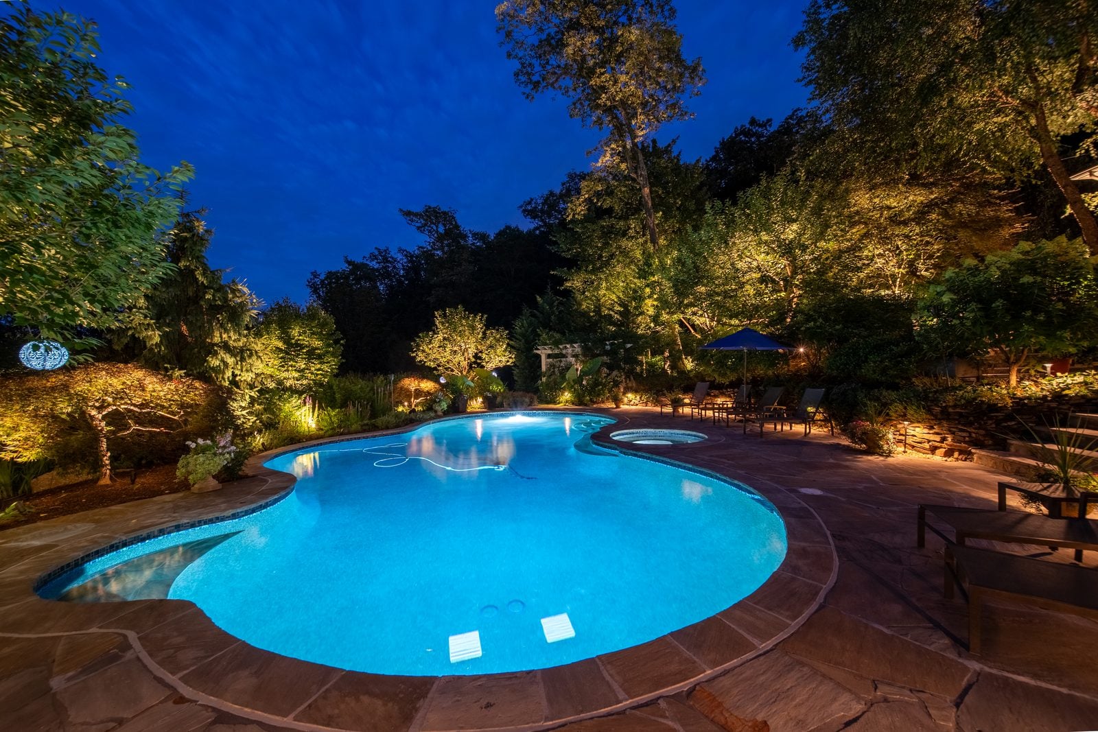 A New Jersey property lit at night by Unique Outdoor Lighting